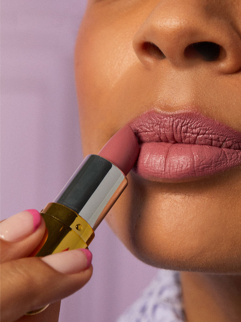 pippy -- close up of brunette model applying matte lip velour lipstick