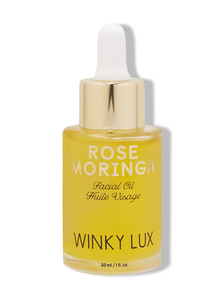 rose moringa facial oil on white background