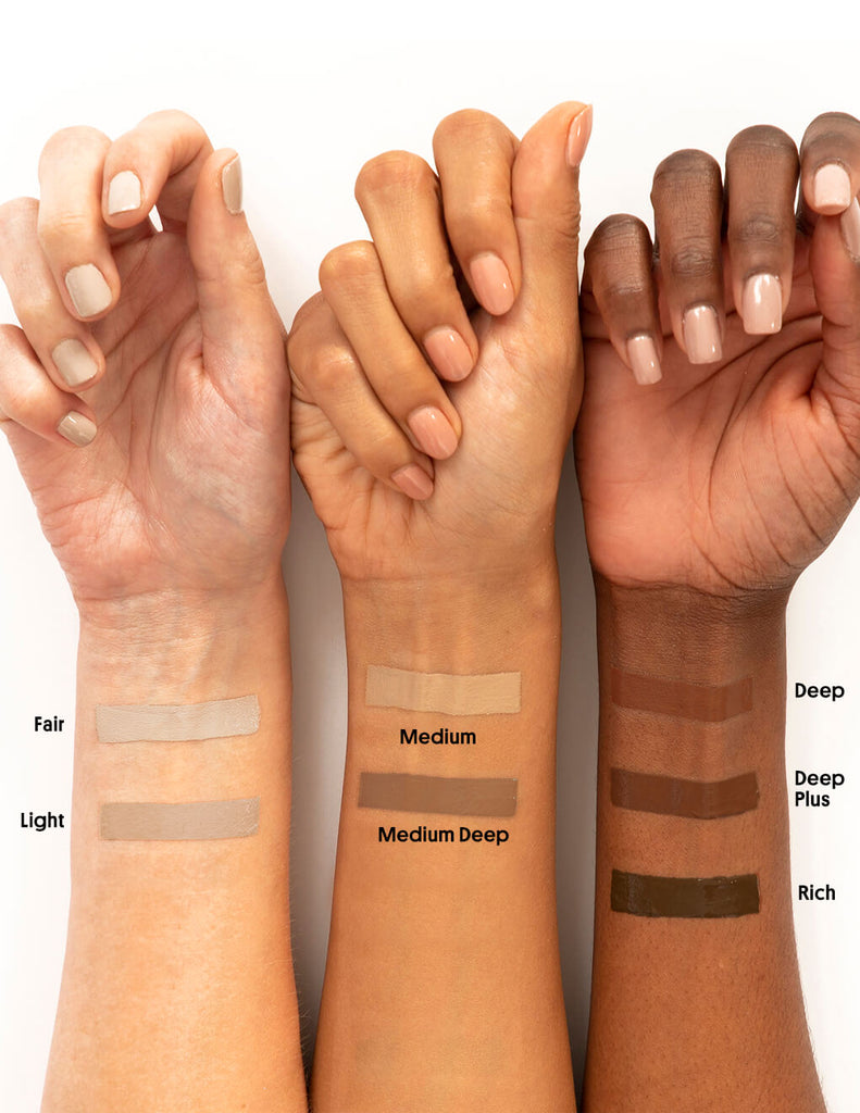Deep/Plus -- close up of model wrist with tinted moisturizer spf shades swatched