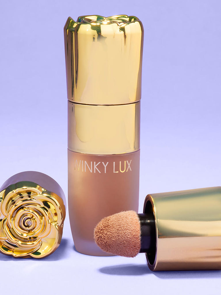 amalfi -- cheeky rose liquid contour sculpt with caps laying next to