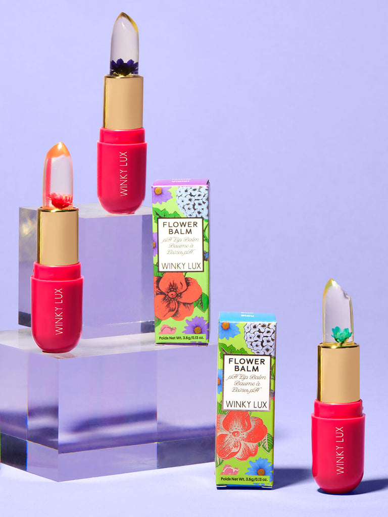 purple -- variety of flower ph lip balms staggered on clear platforms