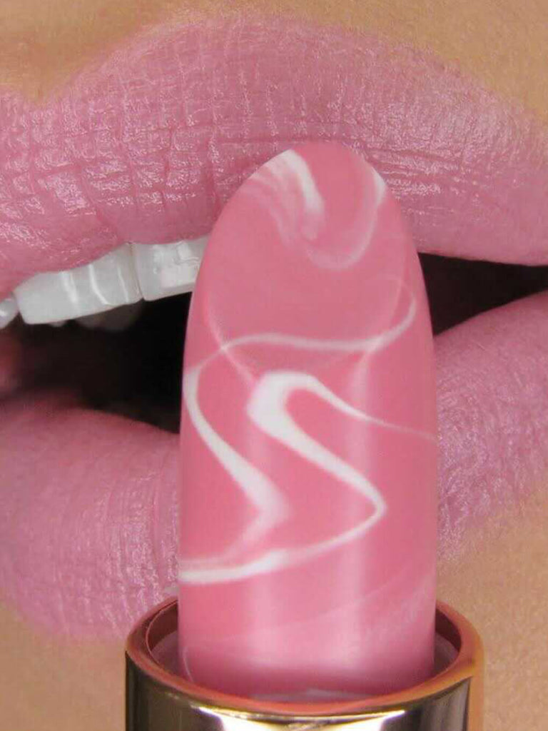 Giddy - close up of model applying Marbleous lip balm on lips