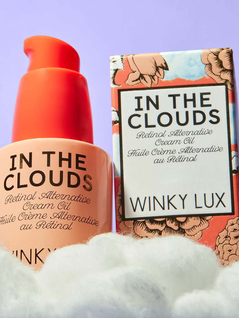 in the clouds plant based retinol alternative sitting on cloud next to box