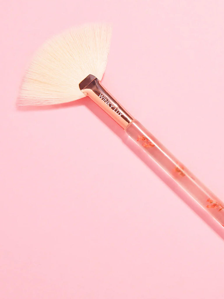 forever flower blending makeup brush on pink background
