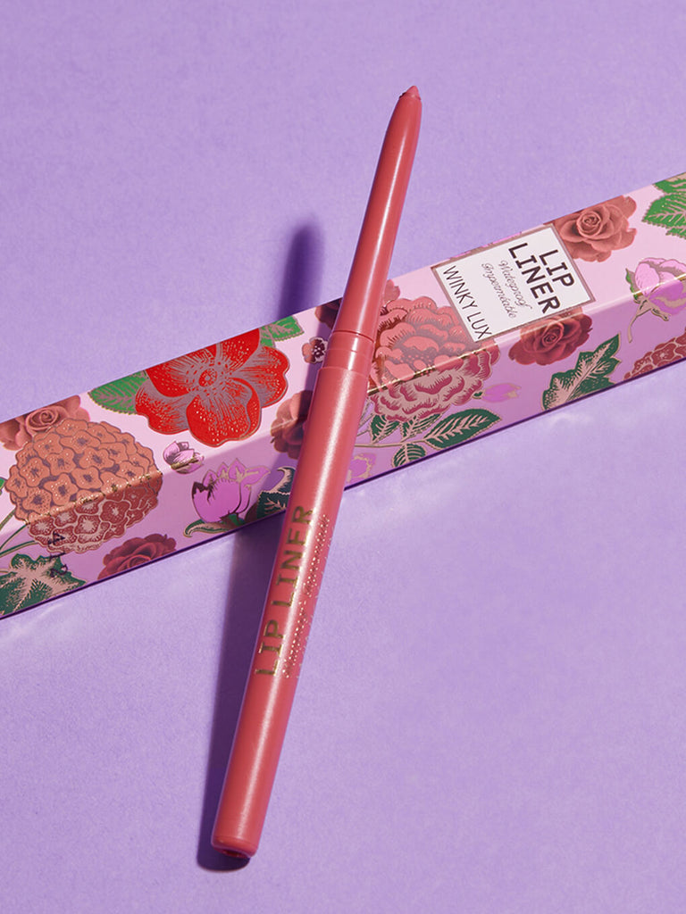 pippy -- waterproof lip liner resting on box on purple background