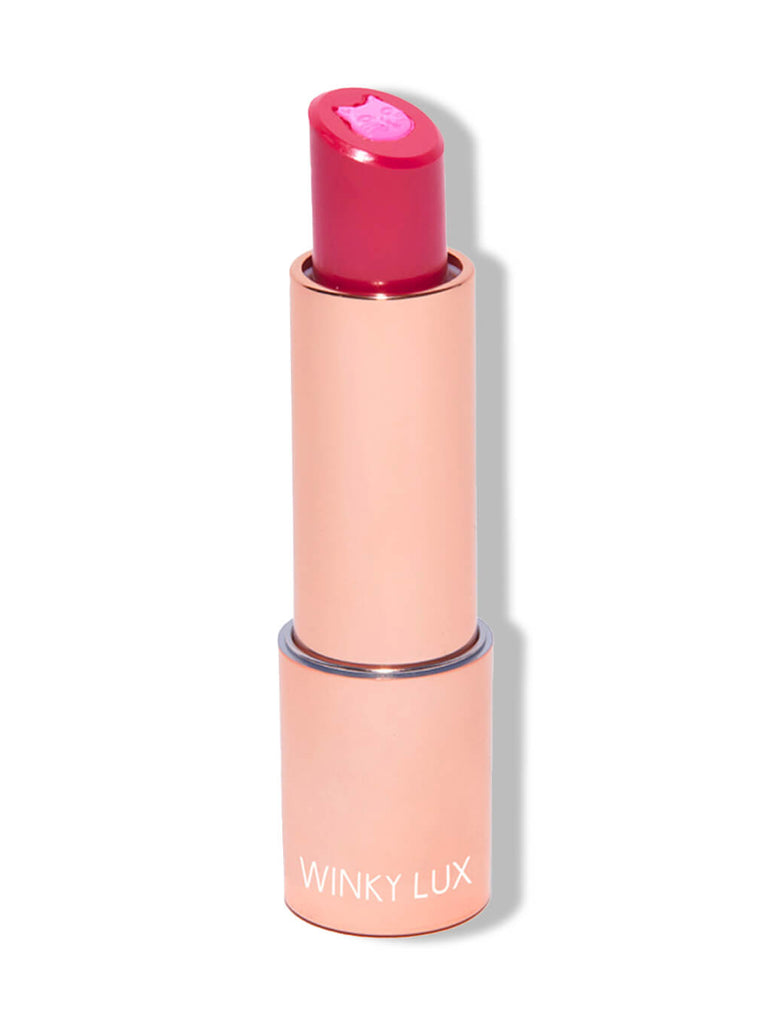 Kiss & Tail -- purrfect pout sheer lipstick on white background