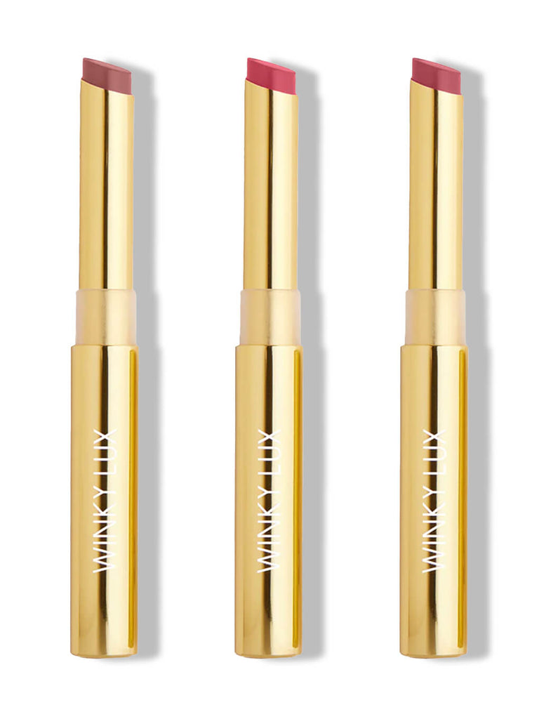 three nude shades of skinny plump demi matte lipstick on white background