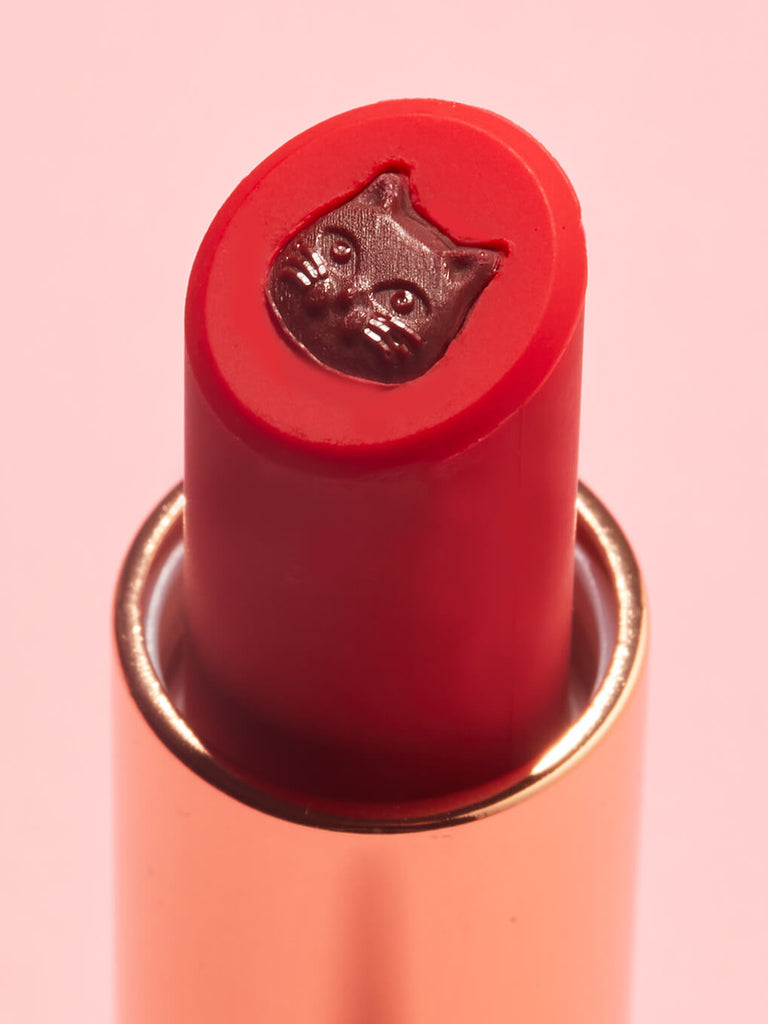 Fur Ever -- close up of purrfect pout sheer red lipstick showing cat stamp