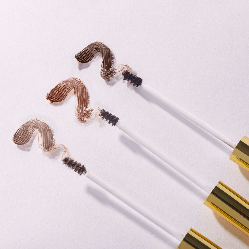 blonde -- unibrow tinted brow gel brushes and swatches on white background