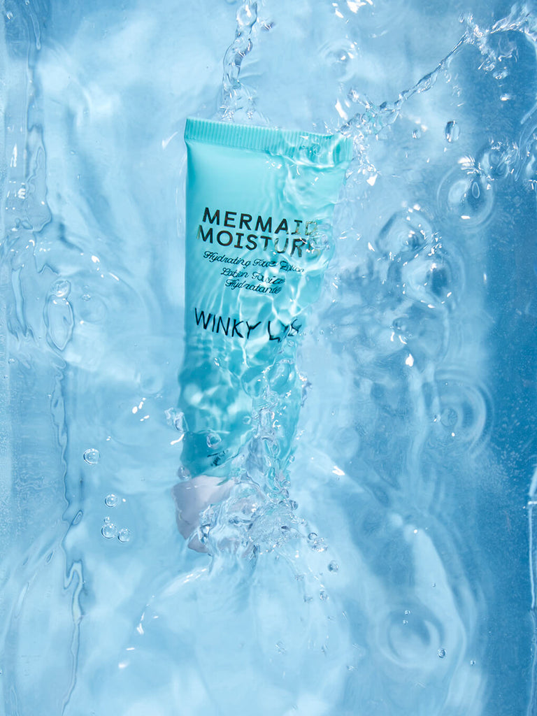 mermaid hydrating face lotion submerged into pool of water