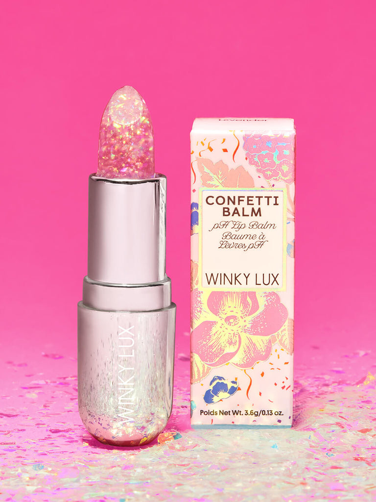 lavender confetti -- glitter confetti ph balm standing next to box on pink background