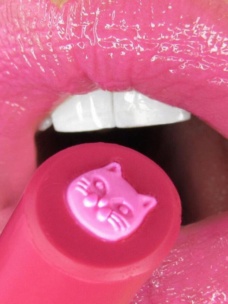 Kiss & Tail -- close up of purrfect pout sheer lipstick on model's lips with mouth open