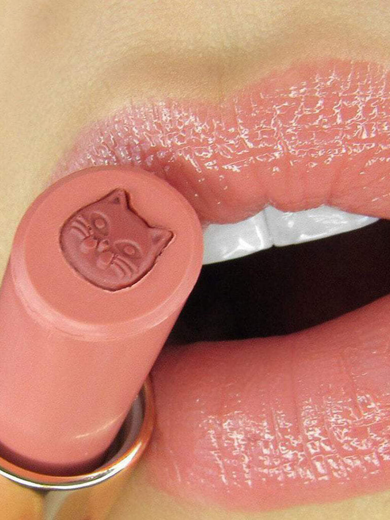 pawsh -- close up of purrfect pout sheer lipstick on model's lips with mouth open