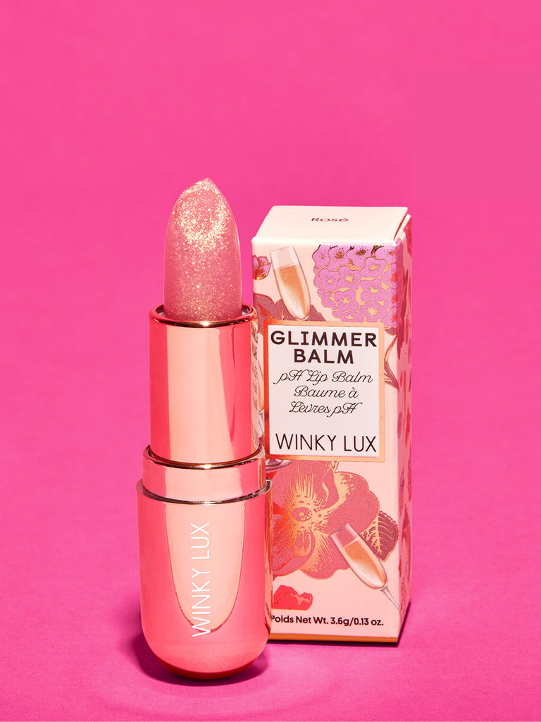 Rosé glimmer -- rosé glimmer ph balm next to box on pink background