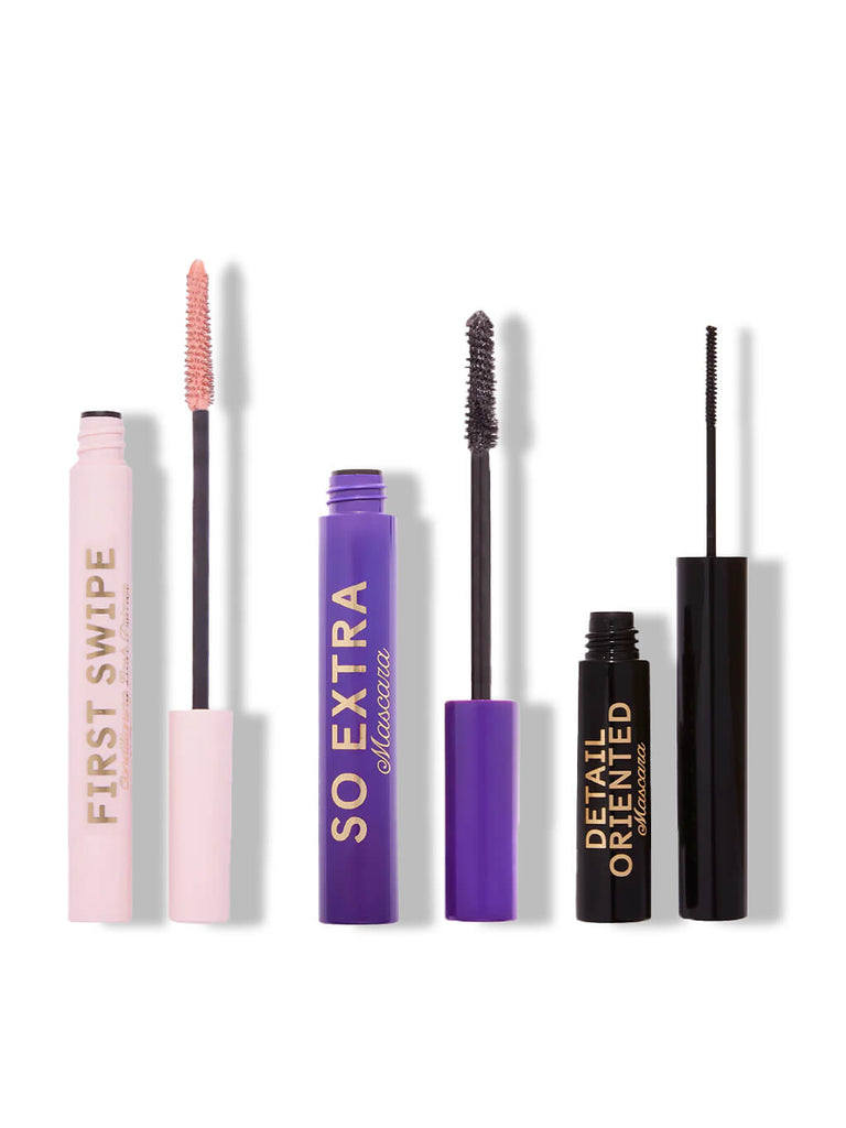 two mascaras and a lash primer on white background