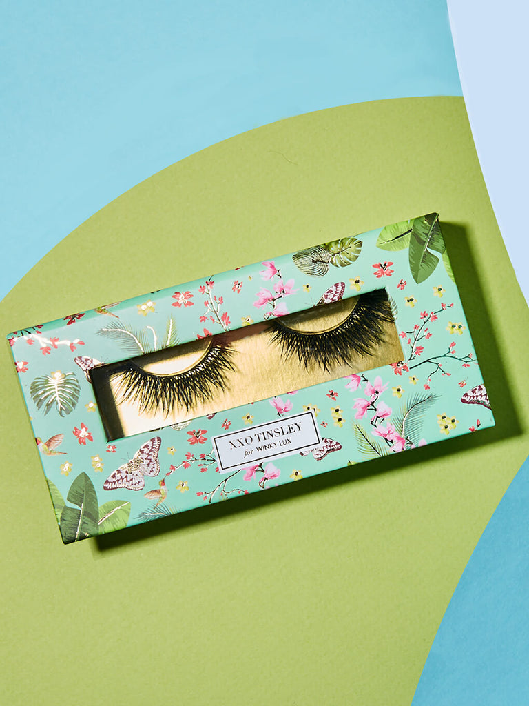 everything -- fake eyelashes in box flat lay on blue and green background