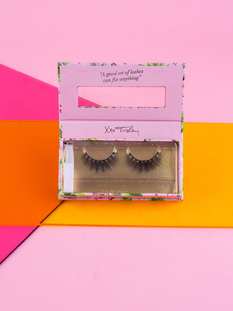babydoll -- fake eyelashes in box flat lay on pink and orange background